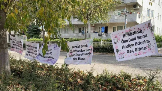 (Özel) Bursa'da eşine kendisini affettirmek için çalıştığı marketin karşısına pankart astı