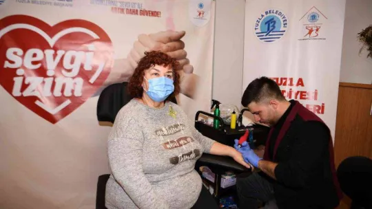 Tuzla'nın özel çocuklarına kaybolma ihtimaline karşı sevgi izi dövmesi yapıldı