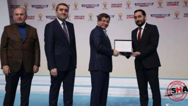 Başbakan'dan Kutlu'ya teşekkür plaketi