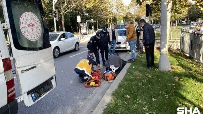 Otomobilin çarptığı kadının üzerine montunu örttü