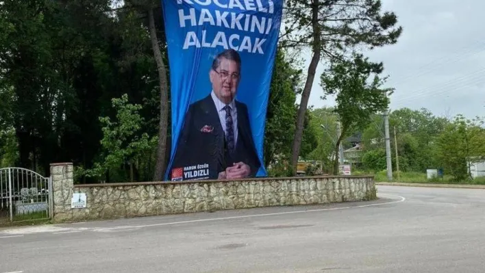 CHP milletvekili adayının seçim afişi mezarlığa asıldı